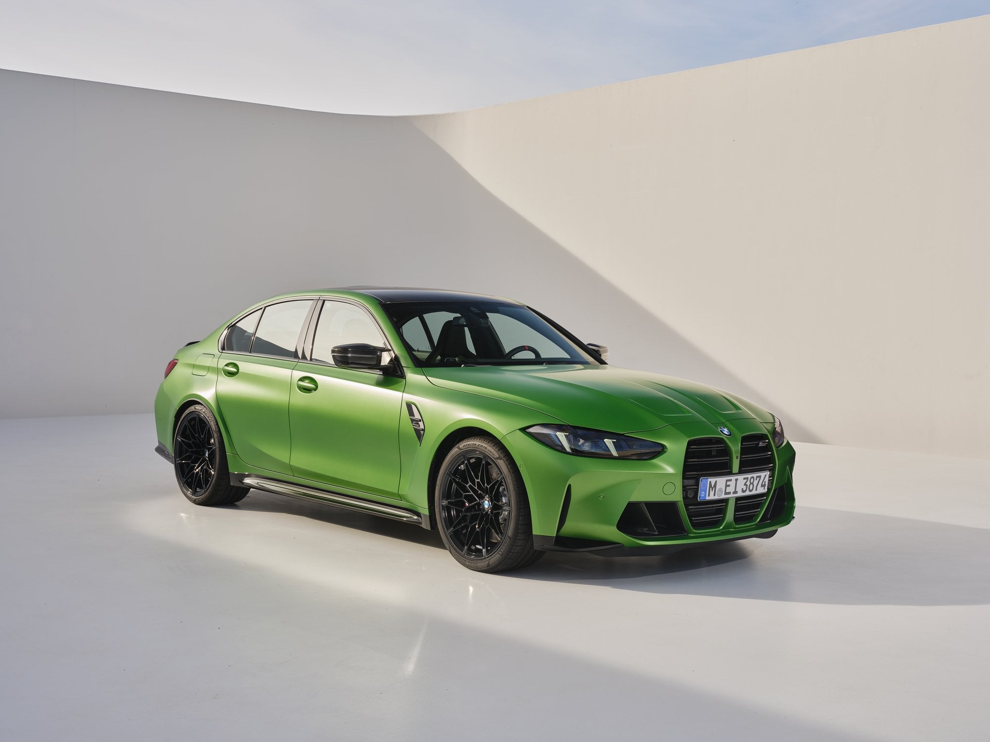 Official BMW press photo of the BMW M3 Sedan front three-quarter in a white studio set