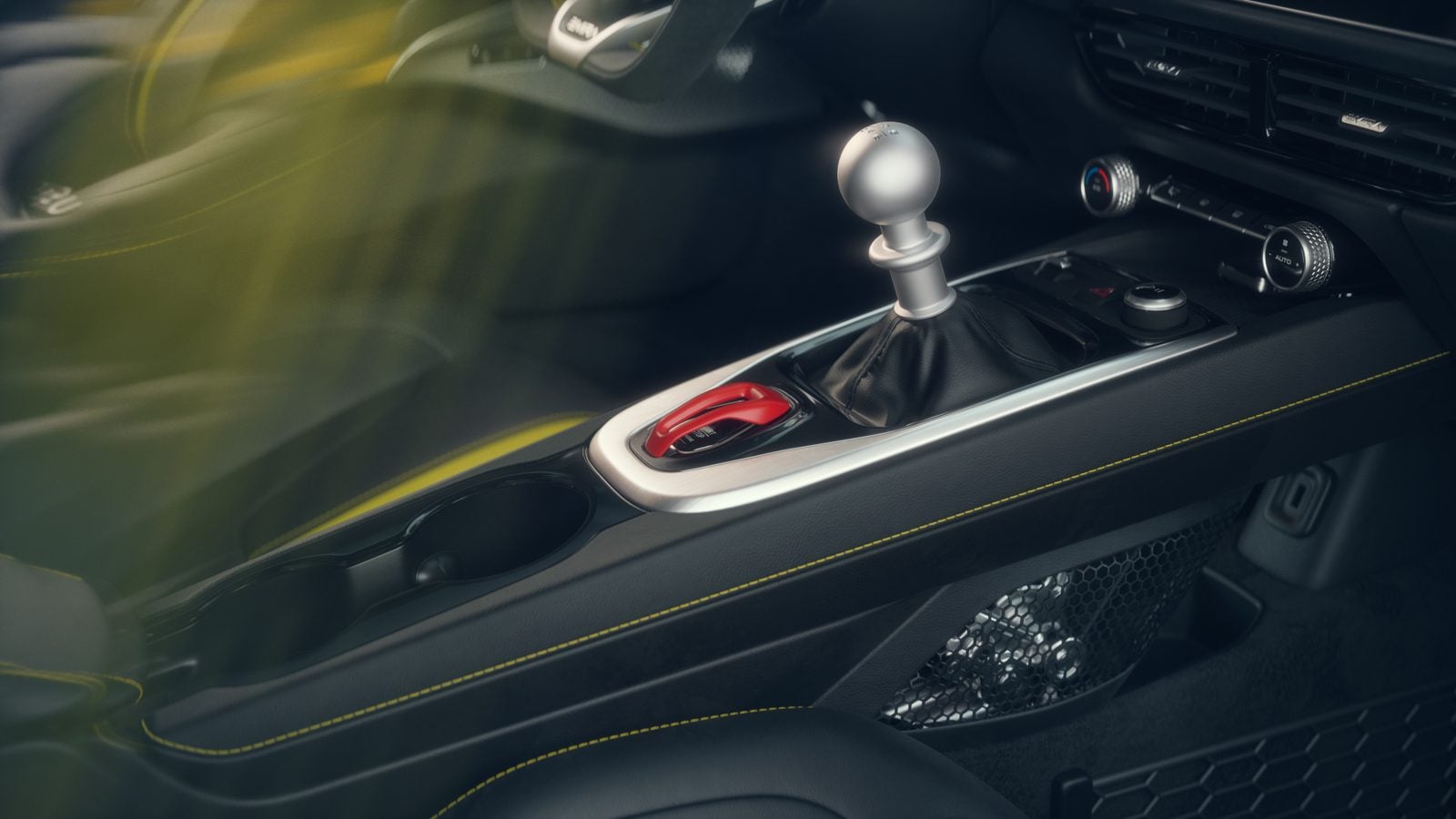 Official Lotus photo of the Emira V6 SE center console with the open-gate six-speed manual shifter