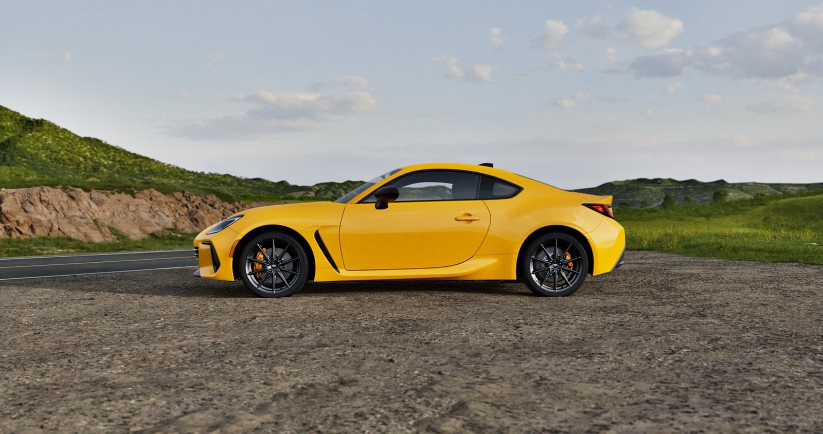 Official Subaru photo of a 2026 Subaru BRZ Series.Yellow in side profile on a gravel lot