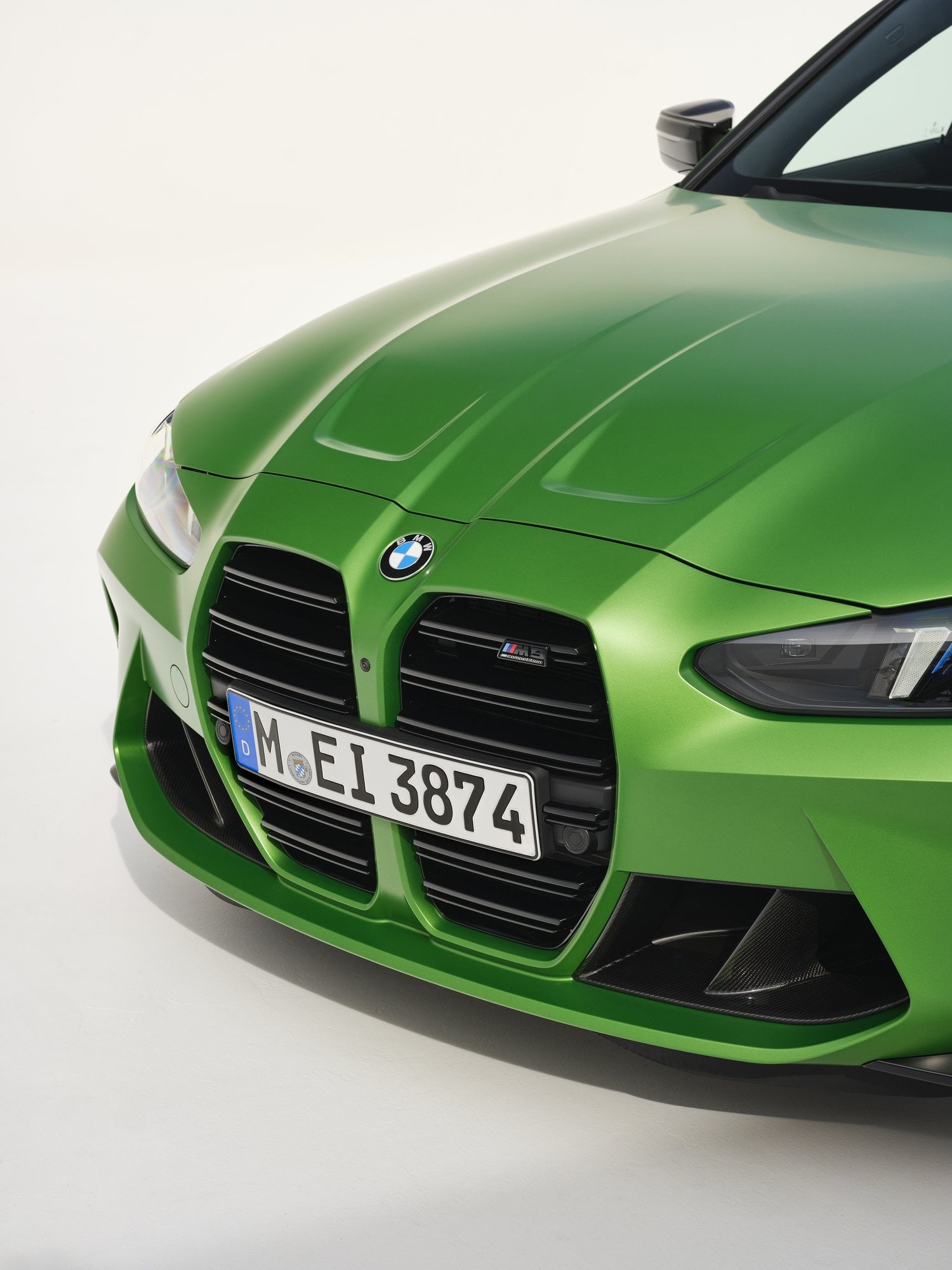 Official BMW press photo detail of the BMW M3 Sedan vertical kidney grille and LED headlight