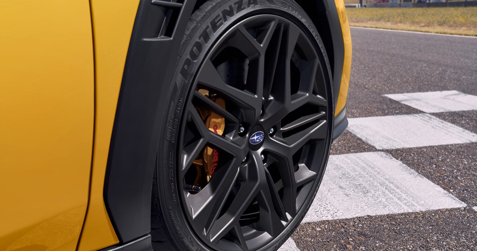 Official Subaru photo of the matte black 19-inch wheel and Brembo caliper on the 2026 Subaru WRX Series.Yellow