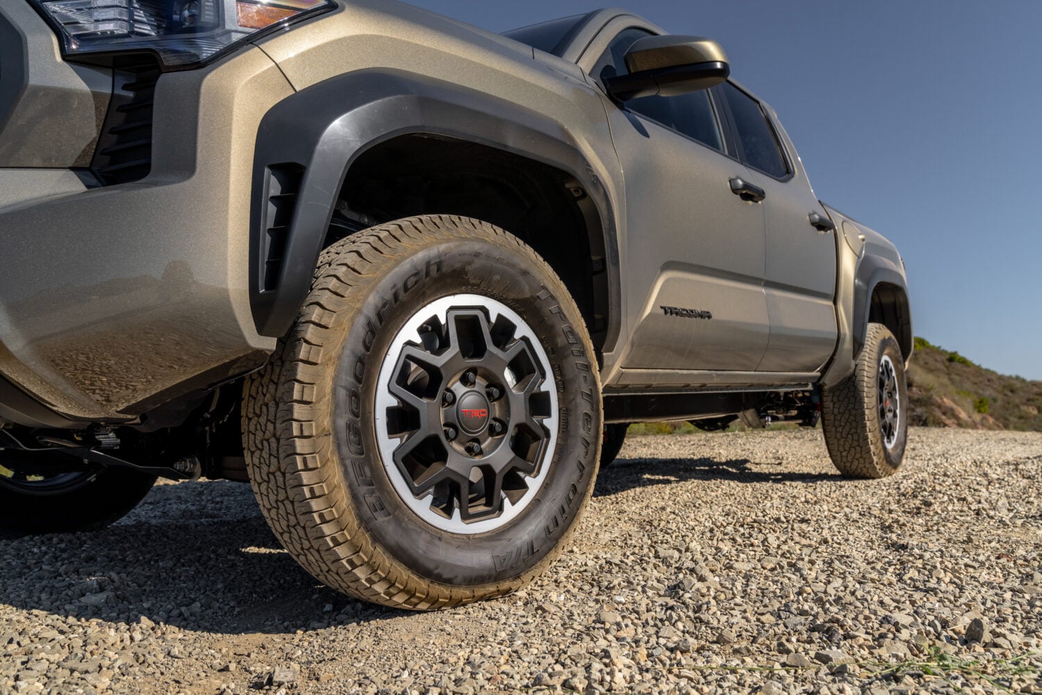 Official Toyota photo of a Tacoma TRD Off-Road front wheel, all-terrain tire and fender flare
