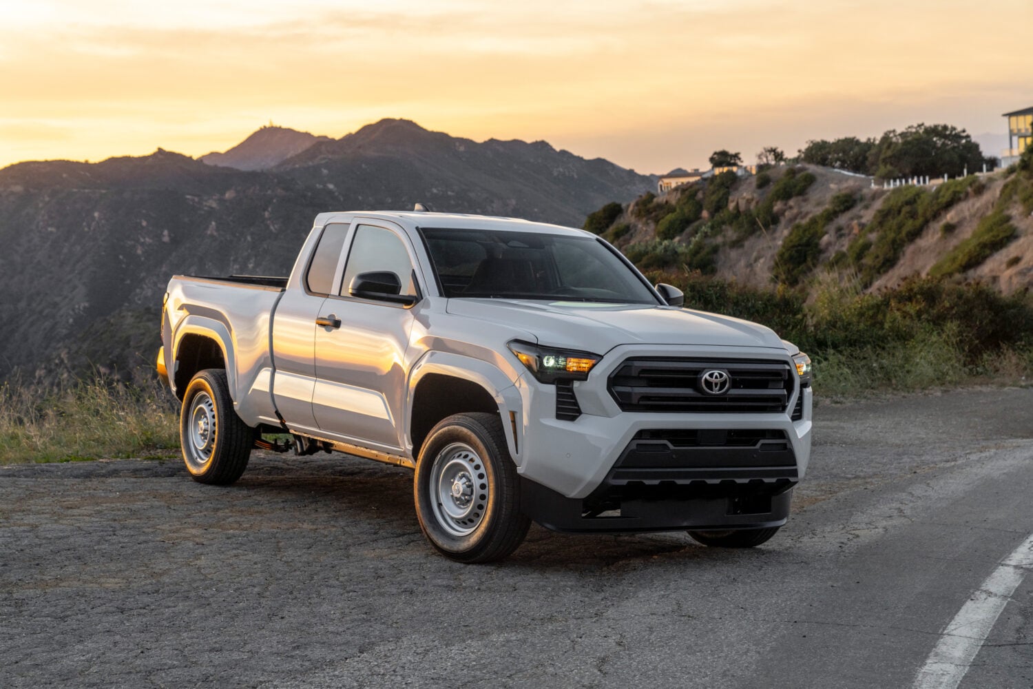 Official Toyota photo of a 2026 Tacoma SR Double Cab in white, front three-quarter
