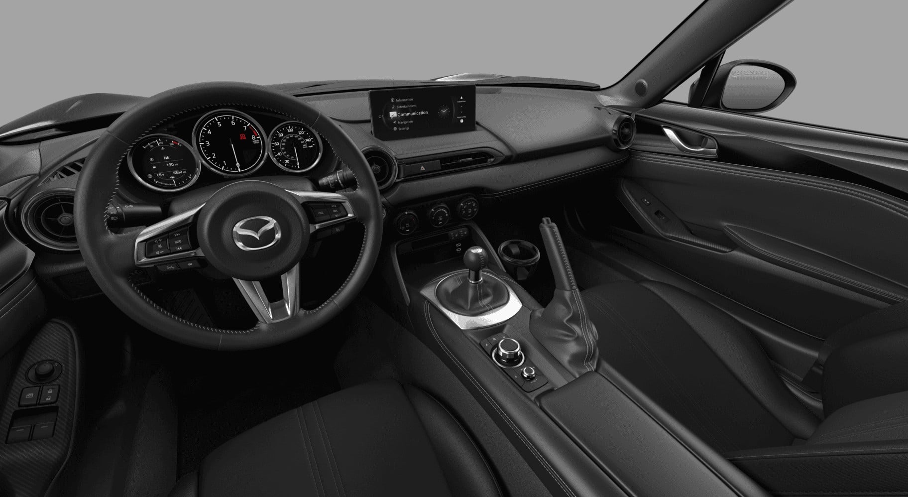 Mazda MX-5 Miata Club cockpit with three-spoke wheel and manual shifter. Image courtesy of Mazda North American Operations.