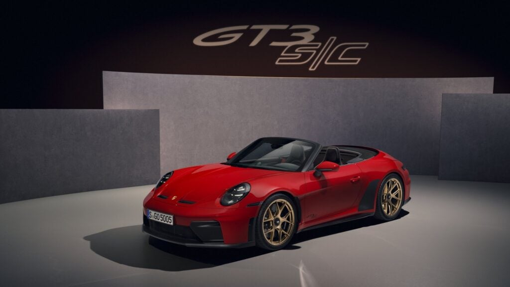 Official Porsche studio photo of a red 2027 Porsche 911 GT3 S/C front three-quarter with GT3 S/C lettering on the wall