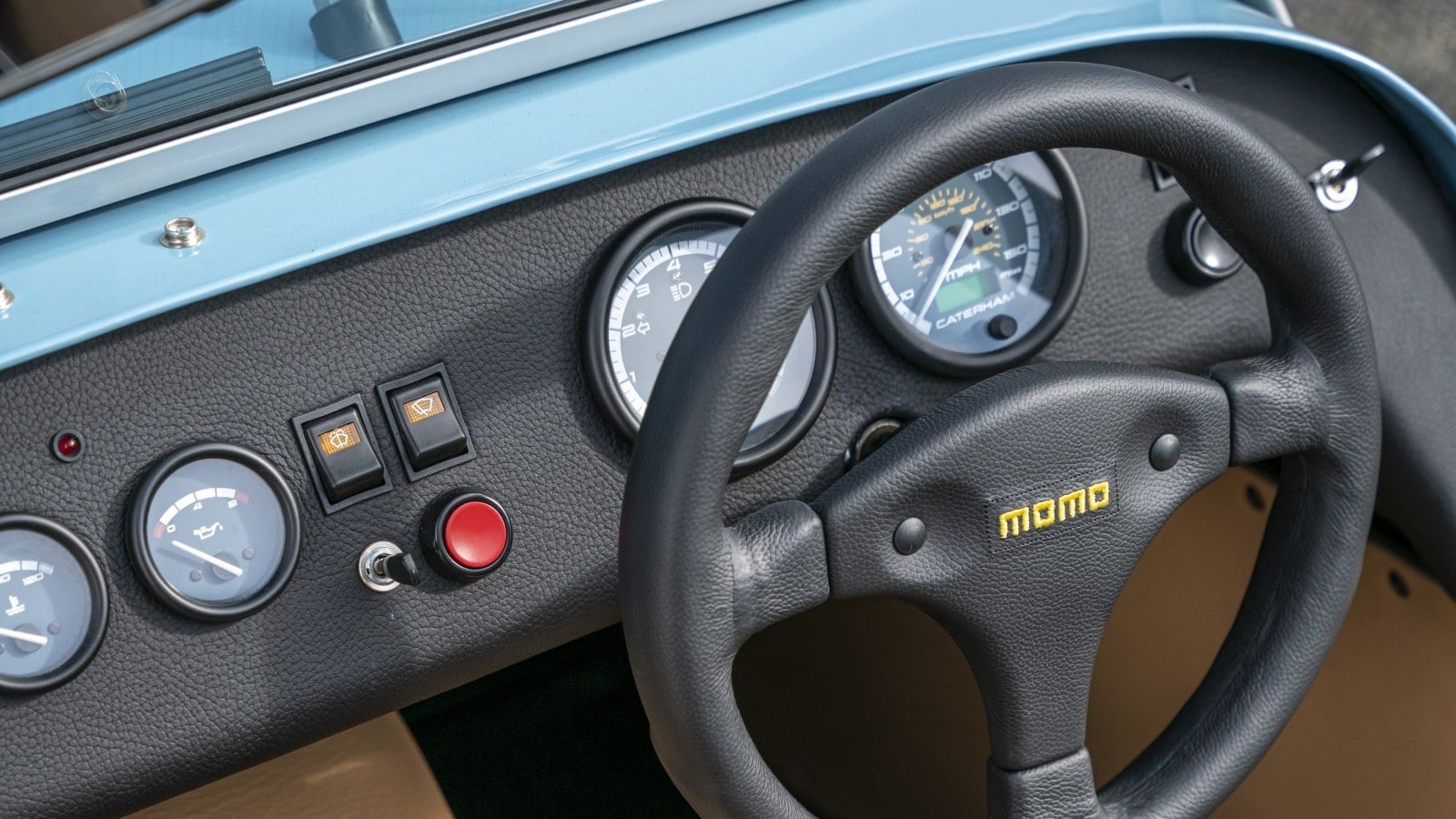 Caterham Seven 170 dashboard with Momo steering wheel and analogue gauges. Image courtesy of Caterham Cars.