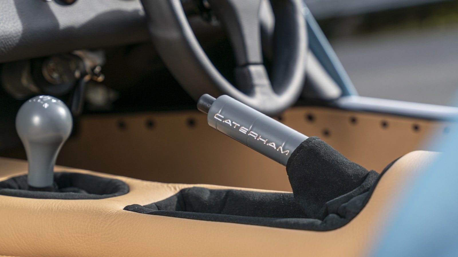 Caterham Seven 170 gear lever and handbrake in a tan interior. Image courtesy of Caterham Cars.