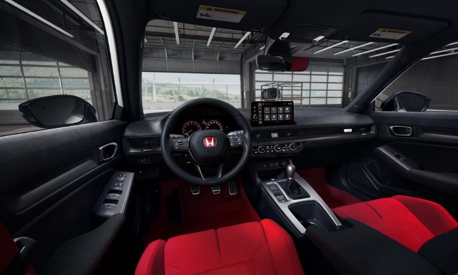 Official Honda photo of the 2027 Civic Type R cabin with red seats, aluminum shift knob, and three pedals