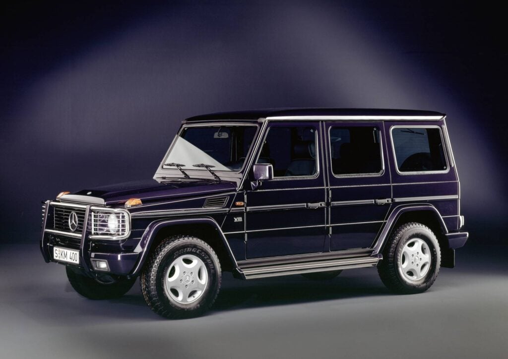 Official Mercedes-Benz studio photo of a dark blue 1993 Mercedes-Benz 500 GE V8 long-wheelbase G-Class front three-quarter view