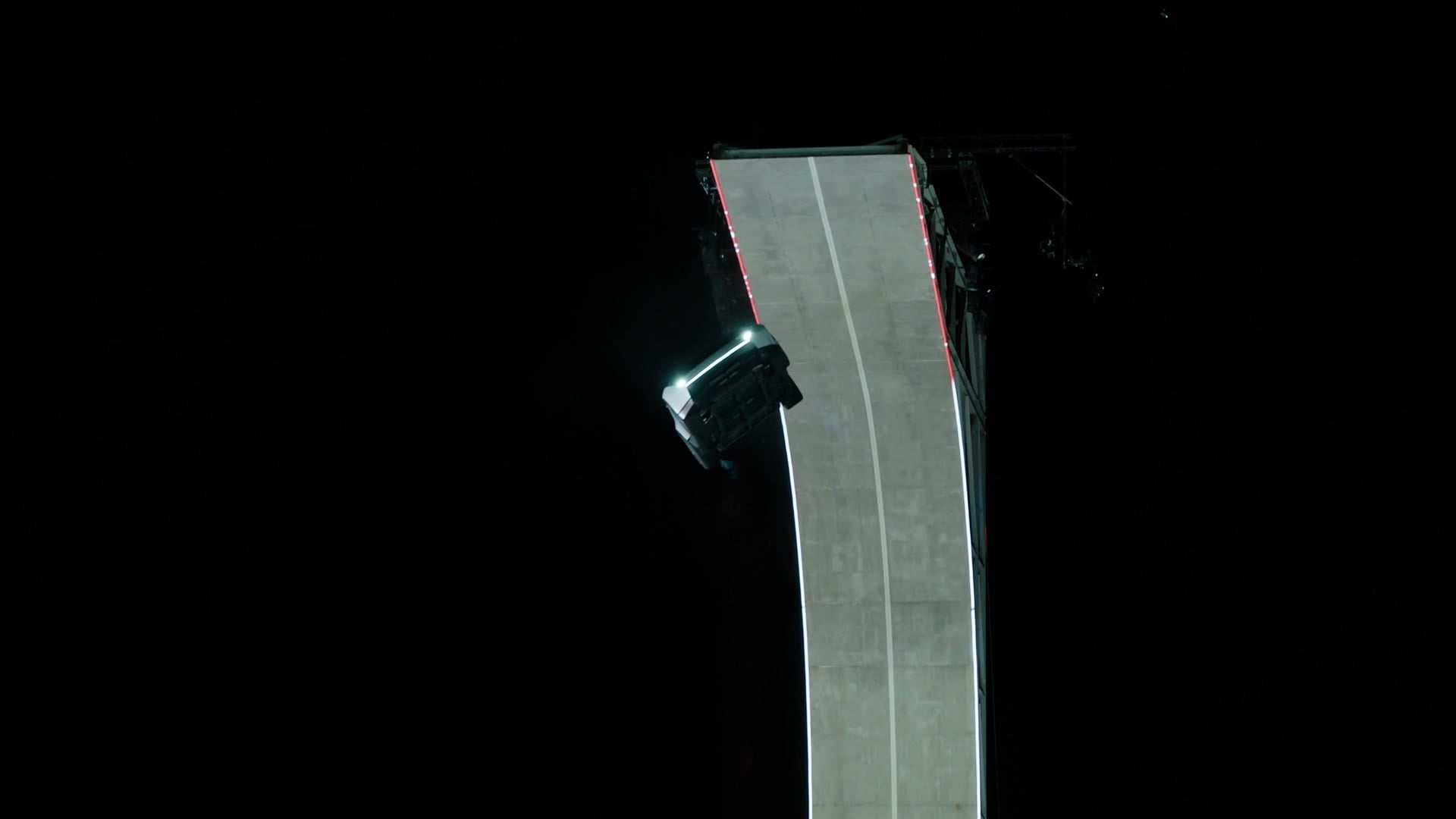 Tesla Roadster prototype flying off an inverted ramp
