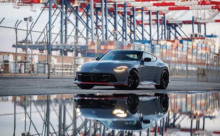Official Nissan photo of a 2027 Nissan Z NISMO MT parked with its reflection in water