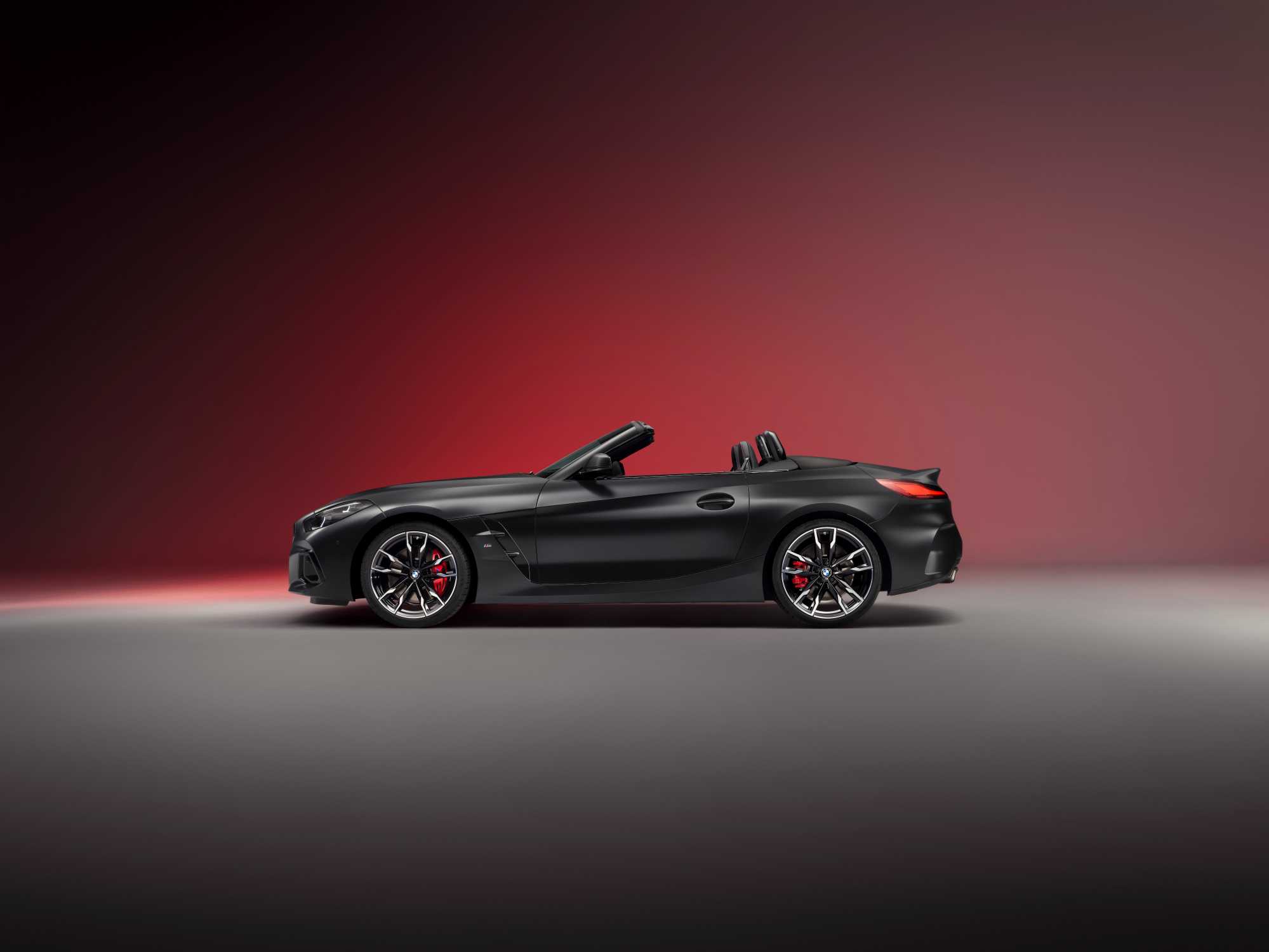 Official BMW photo of a 2026 BMW Z4 Final Edition in profile with the Moonlight Black soft top stowed